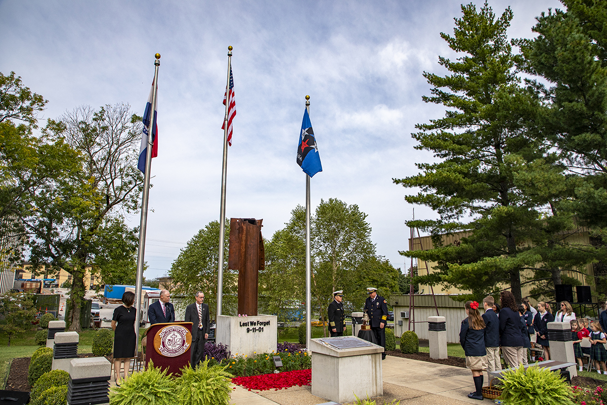 Karen Hobson, who lost her sister, Angela Reed Kyte, in the terrorist attack on 9-11, receives a rose in commemoration from School of the Ozarks student Laura Williamson. Also in attendance were Lucy Willett, who lost her son, John, in the World Trade Center towers, and Orland and Karen Amundson, who lost their son, Army Specialist Craig Amundson, in the Pentagon.